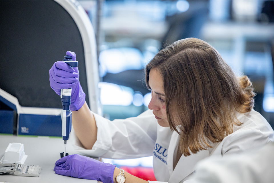 Image of Stella Hoft working and researching in Dr. Richard Dipaolo's Lab