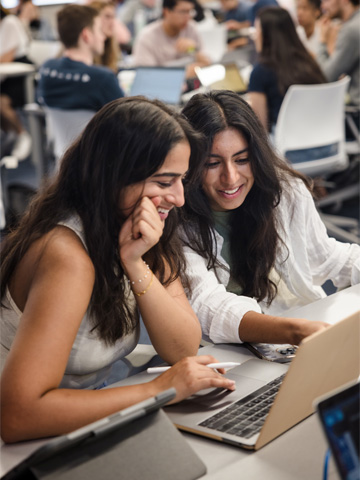 A group of two students working together in the 360 classroom