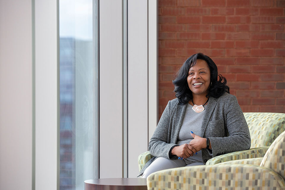 Office Admin Sandra Cornell posing in Doisy Research Building