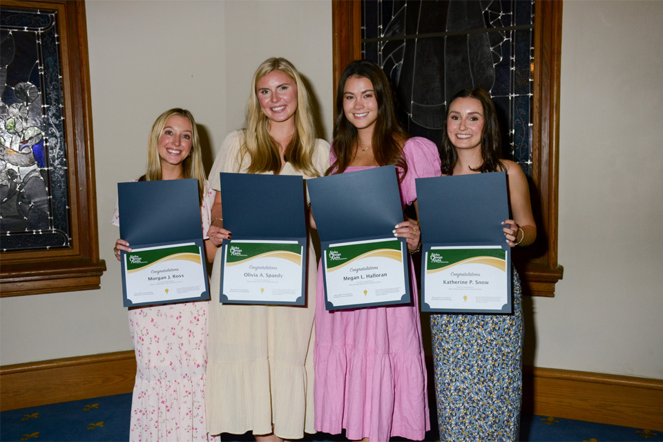 A group of inductees into the Alpha Omega Alpha Medical Honors society A group of inductees into the Alpha Omega Alpha Medical Honors society