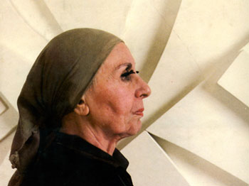 A photograph of artist Louise Nevelson in profile