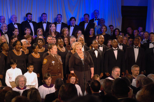 Soprano Christine Brewer leads the combined choruses in the finale of the first Interfaith Memorial in Music