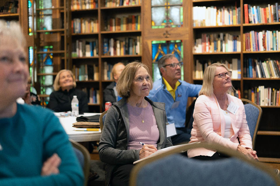 Jane Beato, Don Schreiber, Nellie Nicholson, and other friends of the Catholic Studies Center listen to Fr. Samson’s presentation. Photo by Michael Orosz-Fagen