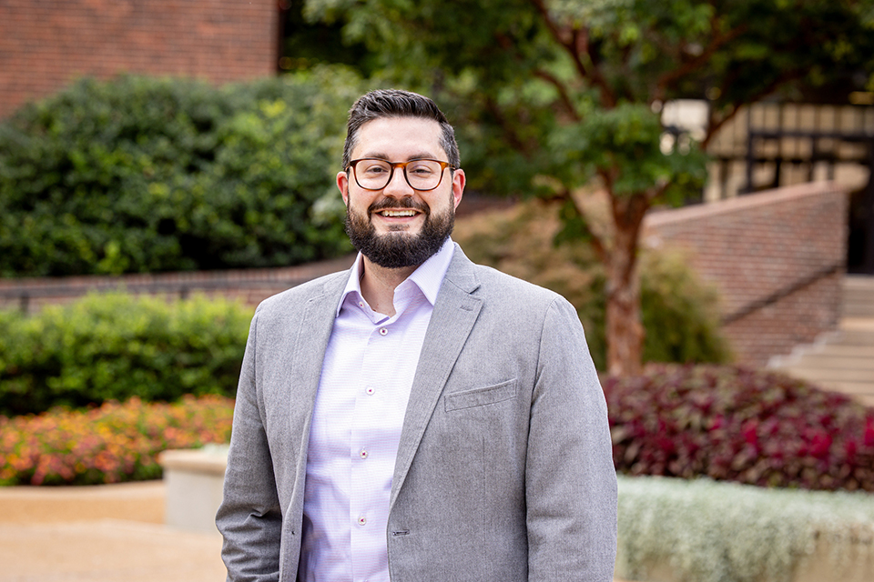 Dr. Jamil Neme smiles for a photo outdoors on SLU's campus. 