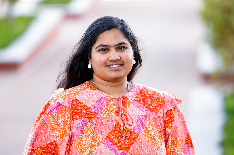Sahiti Kuppa is photographed outdoors on a sunny day on SLU's south campus. 