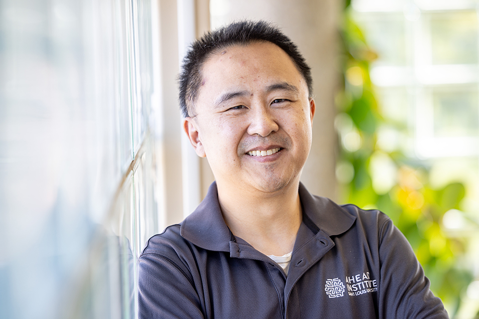 Zidong Zhang, Ph.D., research scientist at the AHEAD Institute at Saint Louis University School of Medicine, poses for a photo indoors. 