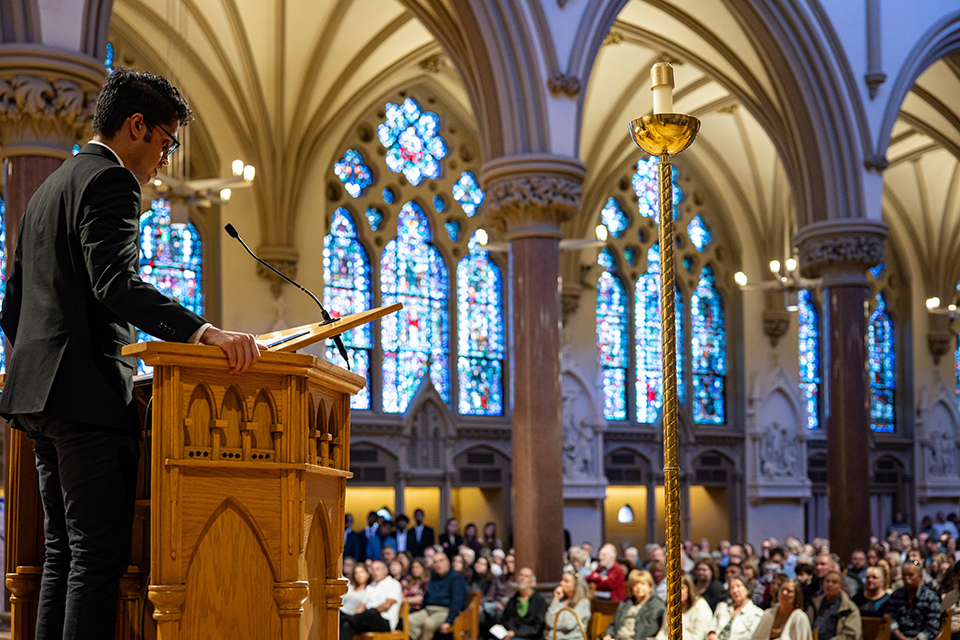 Medical student Abhinav Rajasekhar shares a reflection during the Interfaith Memorial Service to honor gift body donors and their families at Saint Francis Xavier College Church on Friday, Nov. 10, 2023. Photo by Sarah Conroy. 