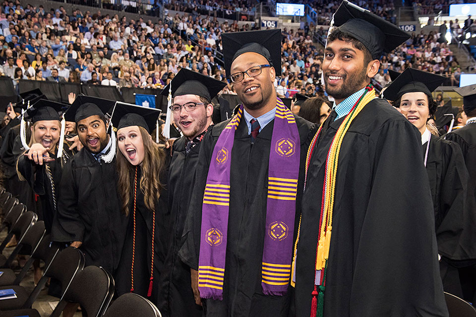 Members of the Class of 2018 pose for a photo on their big day. Photo by Steve Dolan