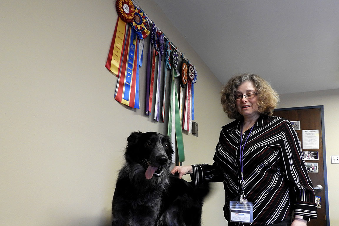 Diana Rupprecht shows off her dogs' awards
