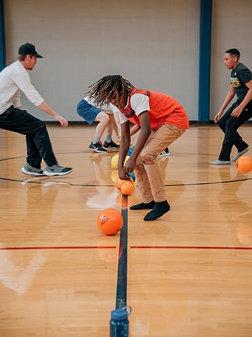 A student takes part in a Catholic School Olympics game