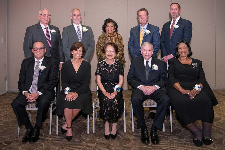 Distinguished alumni were recognized at a dinner Friday, May 20, Front row, from left, are Stephen M. Strum, J.D.; Mary Kay Knight Macheca, R.N.; Suthanya Srisuro, Thomas Nenninger, and Alice F. Roach. Back row, from left, are Thomas P. Shaner, M.D., William L. Carrier, Cecilia A. Nadal, Dennis M. Jenkerson, and Jerry Sax.   Not pictured are Isiaah Crawford, Ph.D.; Jennifer L. McDaniel, M.S.; Phillip Edward Sowa, and Thomas J. Reese. Photo by Steve Dolan. 