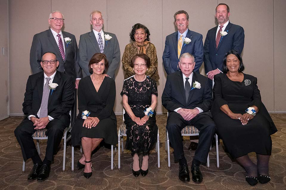 Distinguished alumni were recognized at a dinner Friday, May 20, Front row, from left, are Stephen M. Strum, J.D.; Mary Kay Knight Macheca, R.N.; Suthanya Srisuro, Thomas Nenninger, and Alice F. Roach. Back row, from left, are Thomas P. Shaner, M.D., William L. Carrier, Cecilia A. Nadal, Dennis M. Jenkerson, and Jerry Sax.   Not pictured are Isiaah Crawford, Ph.D.; Jennifer L. McDaniel, M.S.; Phillip Edward Sowa, and Thomas J. Reese. Photo by Steve Dolan.