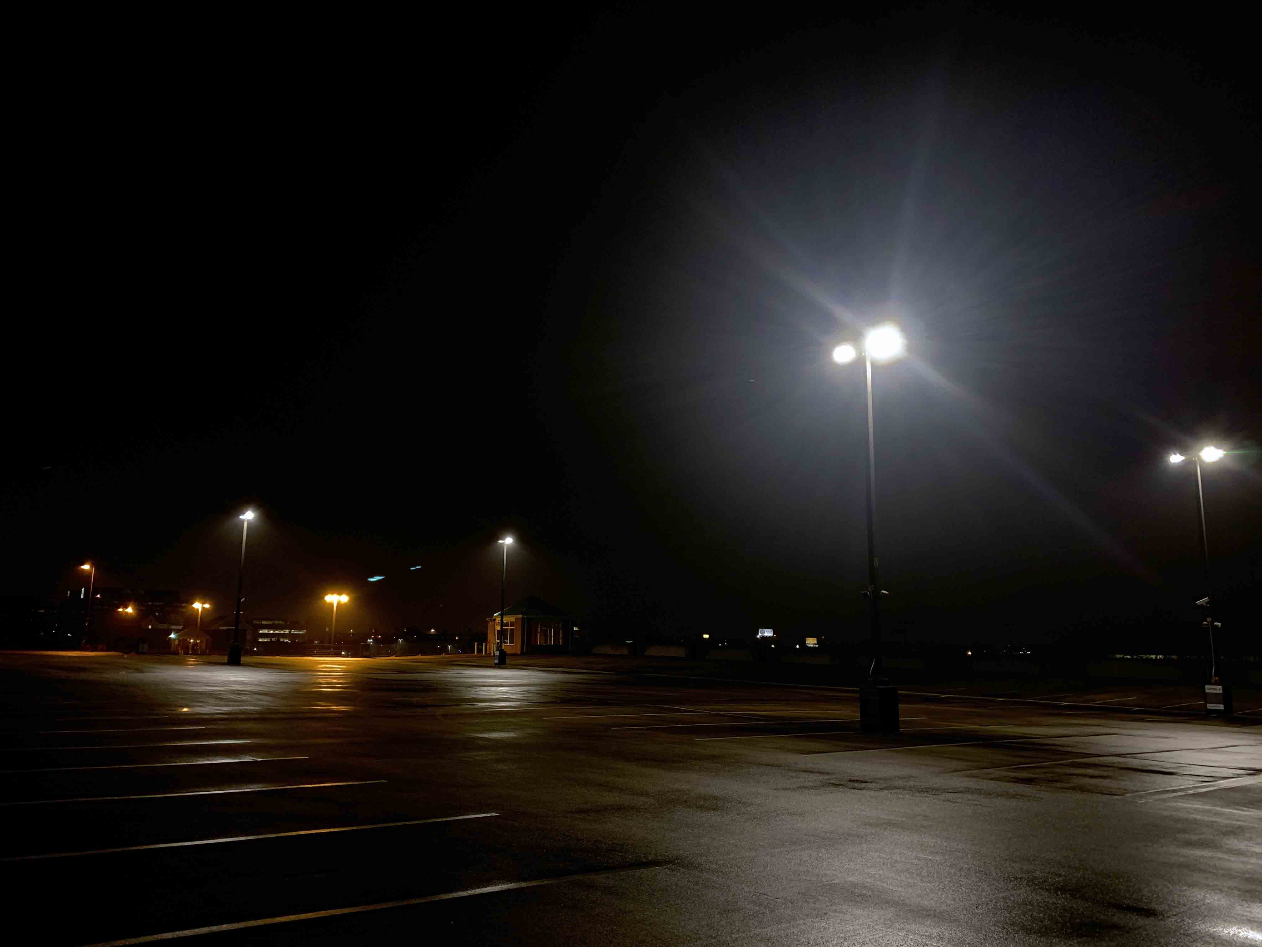 New lights on the upper level of the Olive-Compton parking lot can be seen at night. 