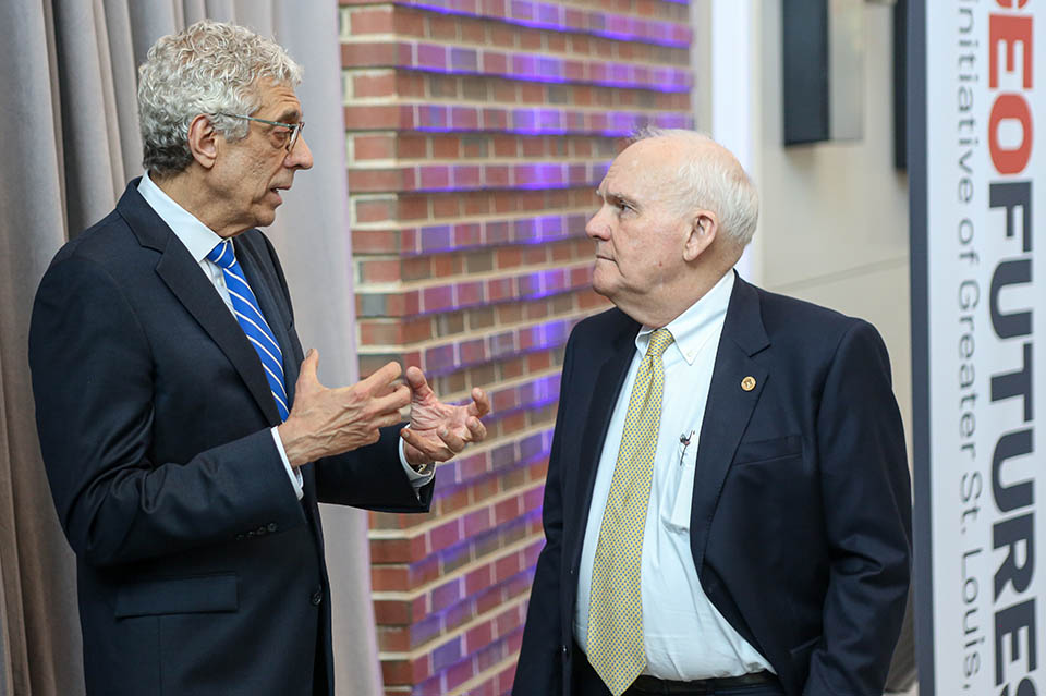 SLU President Fred P. Pestello, Ph.D., speaks with Andrew C. Taylor, Executive Chairman of Enterprise Inc. and Founding Chair of Greater St. Louis Inc., after the launch of the Taylor Geospatial Institute on April 21, 2022. Photo by Sarah Conroy.  .