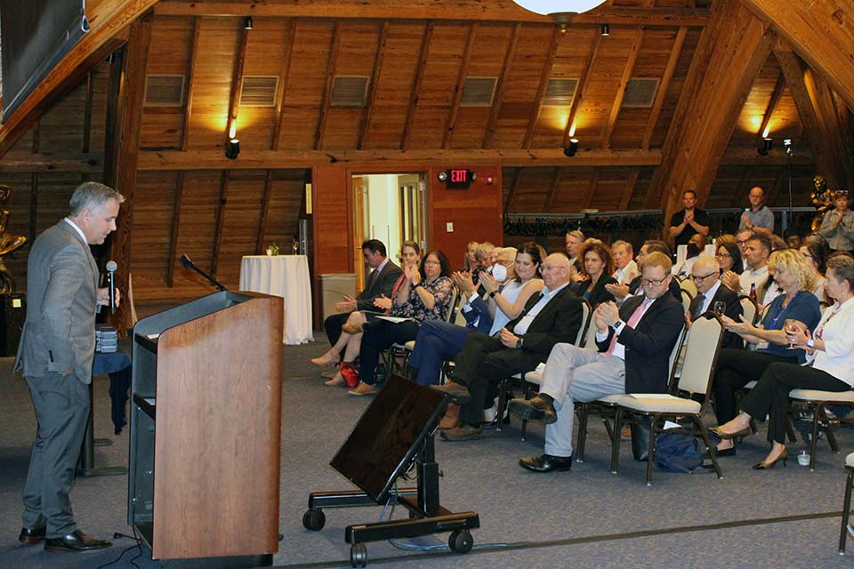 SLU Provost Michael Lewis, Ph.D., addresses the crowd at the Research Institute Fellows and Scholarly Works Awards Reception. Photo by Joe Barker. 