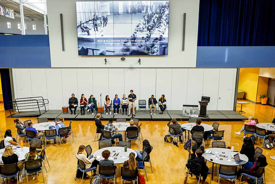 Members of the SLU community listen as speeches from Martin Luther King Jr. are read by the Martin Luther King Scholars in the Center for Global Citizenship on the anniversary of his 1964 visit to SLU on October 12, 2022.