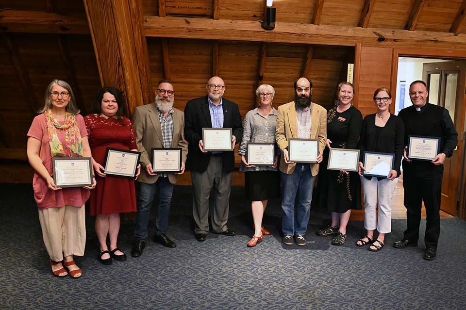 Members of the College of Arts and Sciences pose with their awards.