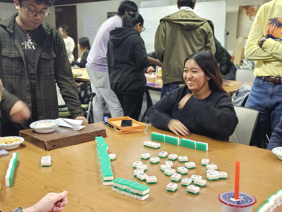 Students playing the 19th-century Chinese game, Mah Jongg at the International Game Night at the Center for Global Citizenship on Monday, Nov. 13. Photo by DICE.