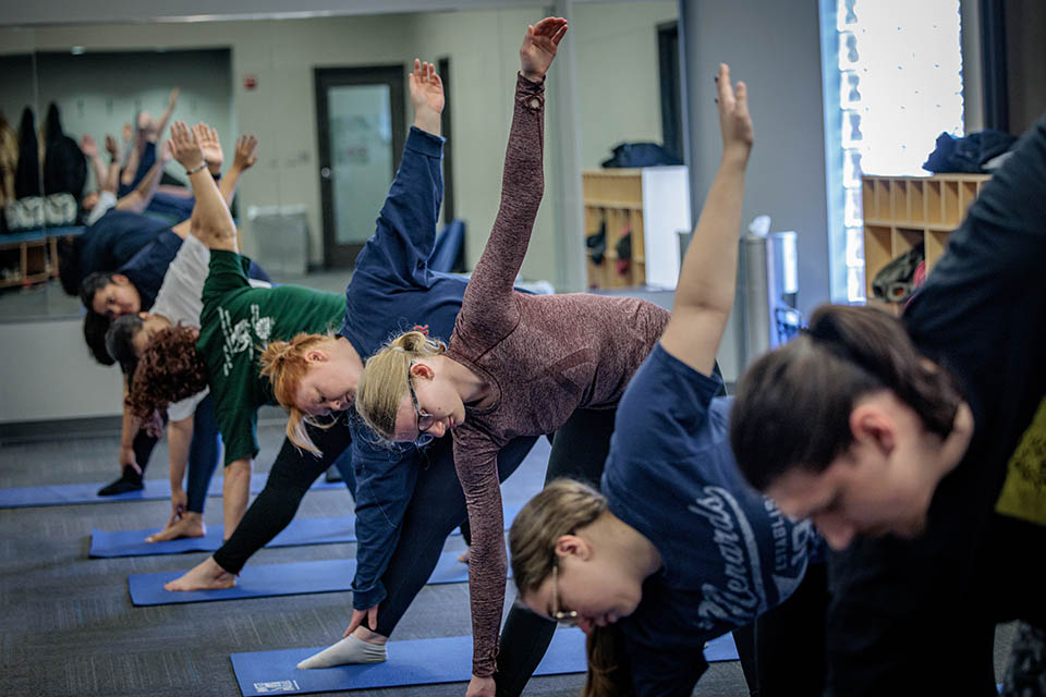 Members of the SLU community participate in a yoga class during wellness day on February, 10, 2023. Photo by Sarah Conroy.