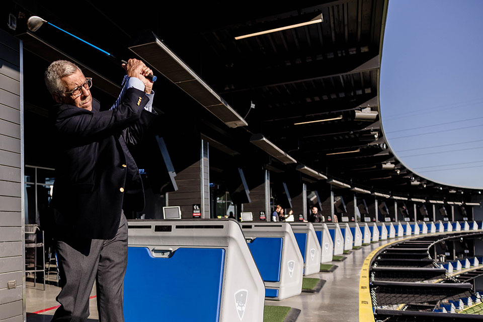President Fred P. Pestello, Ph.D., tees off at the new Topgolf St. Louis Midtown after the ribbon-cutting ceremony on October 20, 2023.