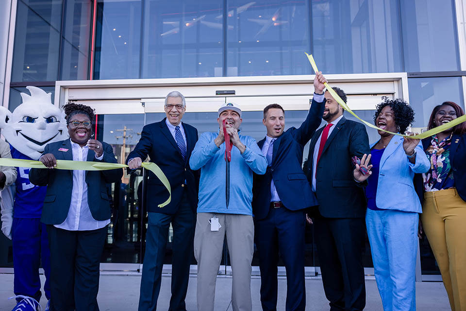 The ribbon is cut to open the new Topgolf St. Louis Midtown on October 20, 2023.