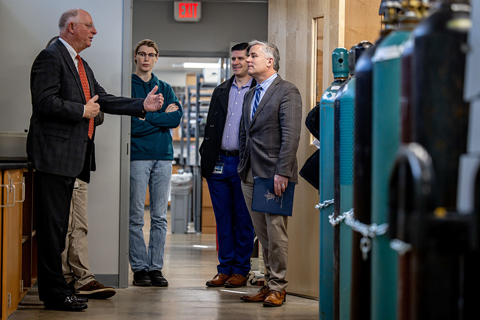 Provost Michael Lewis, Ph.D., and others tour the new labs in Monsanto Hall during the Grand Re-Opening celebration on Thursday, Nov. 2. Photo by Sarah Conroy.