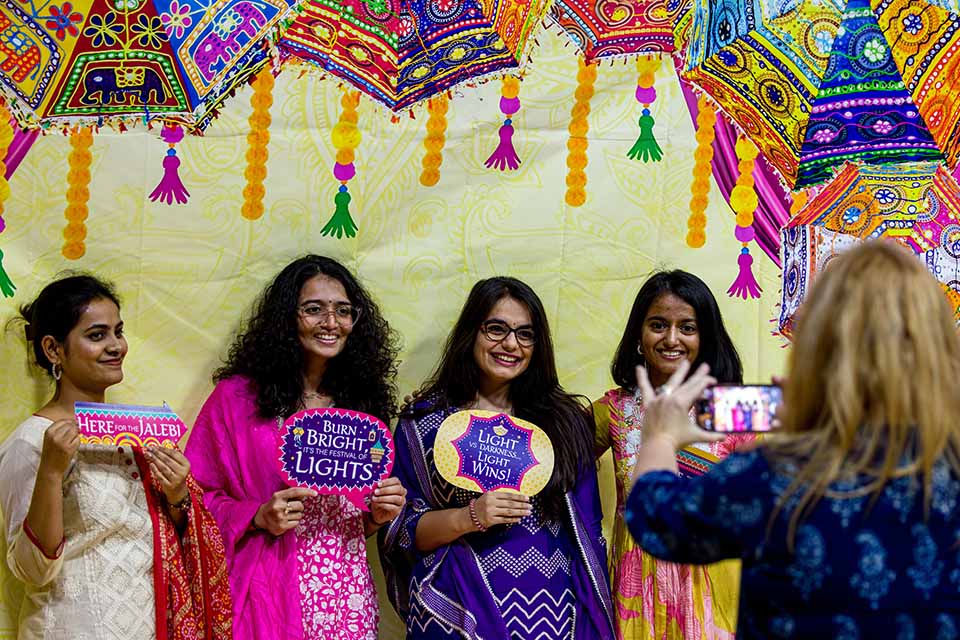 International students posing for a photo at the Taste of Diwali event at the Center for Global Citizenship Auditorium on Thursday, Nov. 16, 2023. Photo by Sarah Conroy.