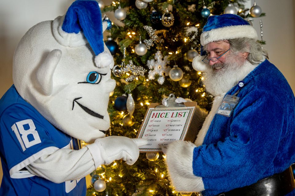 Blue Santa and the Billiken check their nice list. 