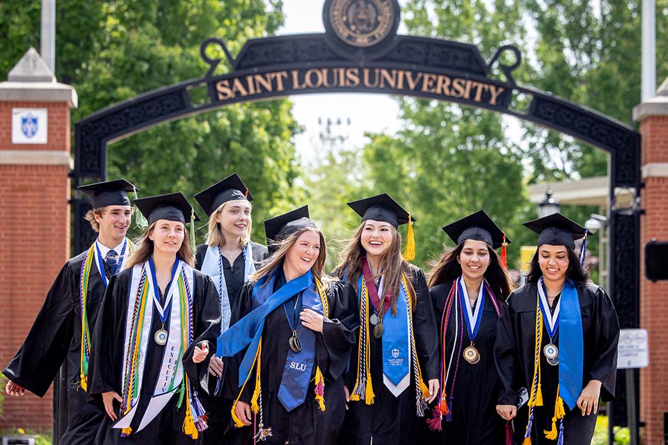 Graduates cross Grand Blvd. 