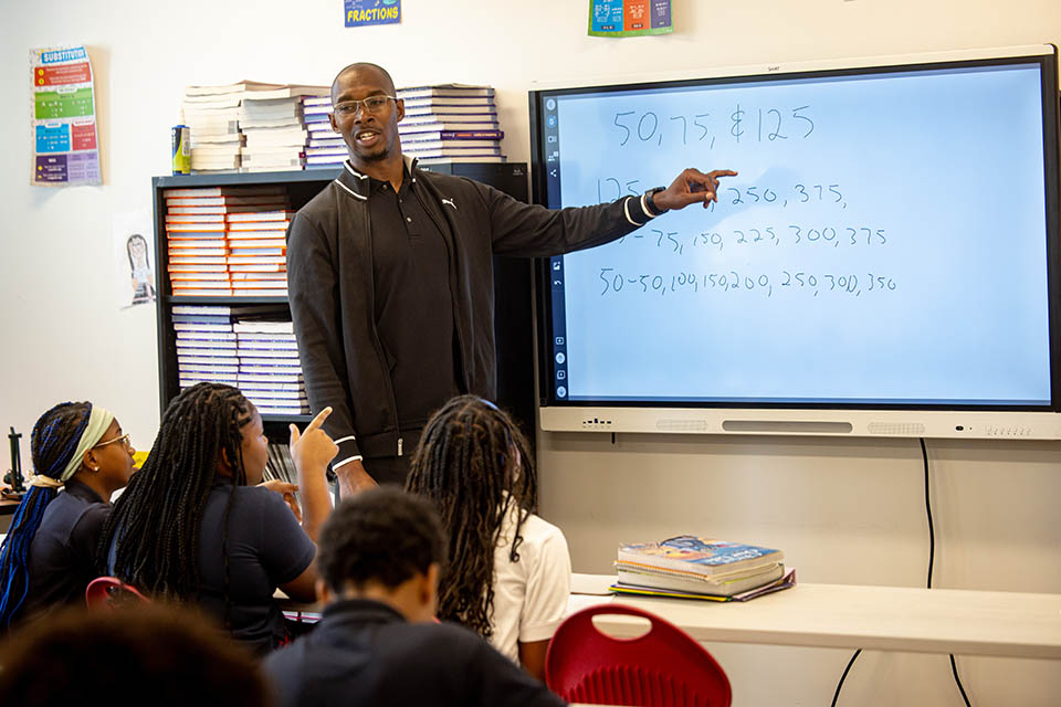 Math teacher Jamal Cooper leads a class of middle school students at St. Louis Catholic Academy on Sept. 16, 2024. Photo by Sarah Conroy.

