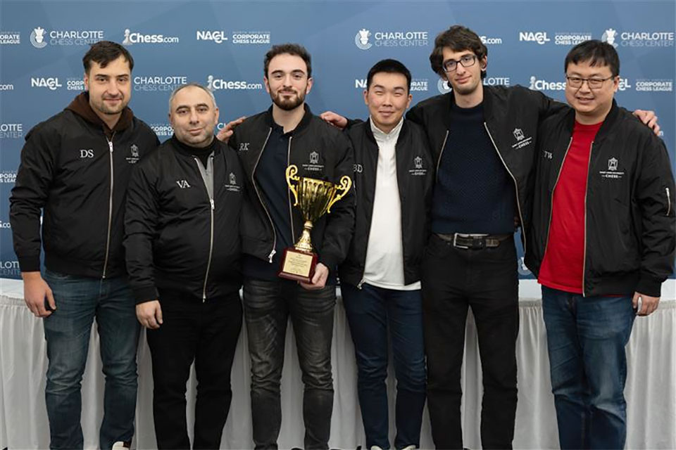 men pose for a photo