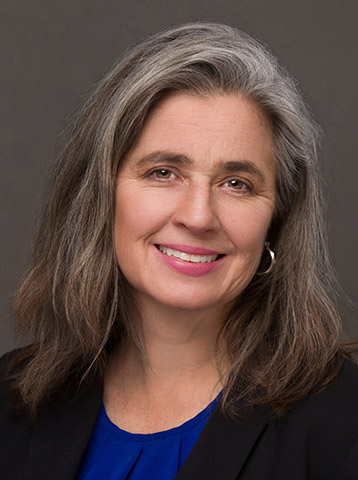 a woman poses for a portrait