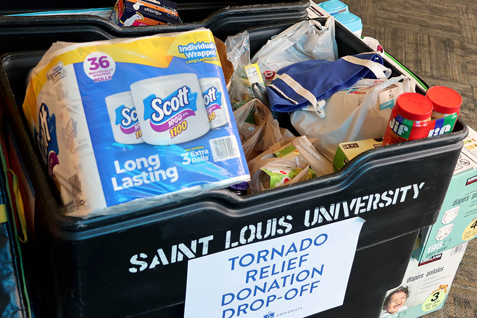 A full bin of donated items to benefit tornado victims. 