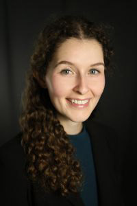a woman poses for a picture