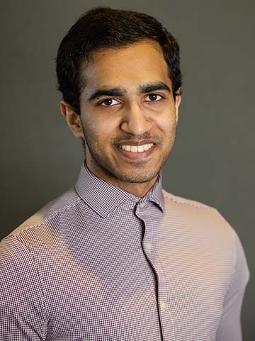 a man poses for a picture