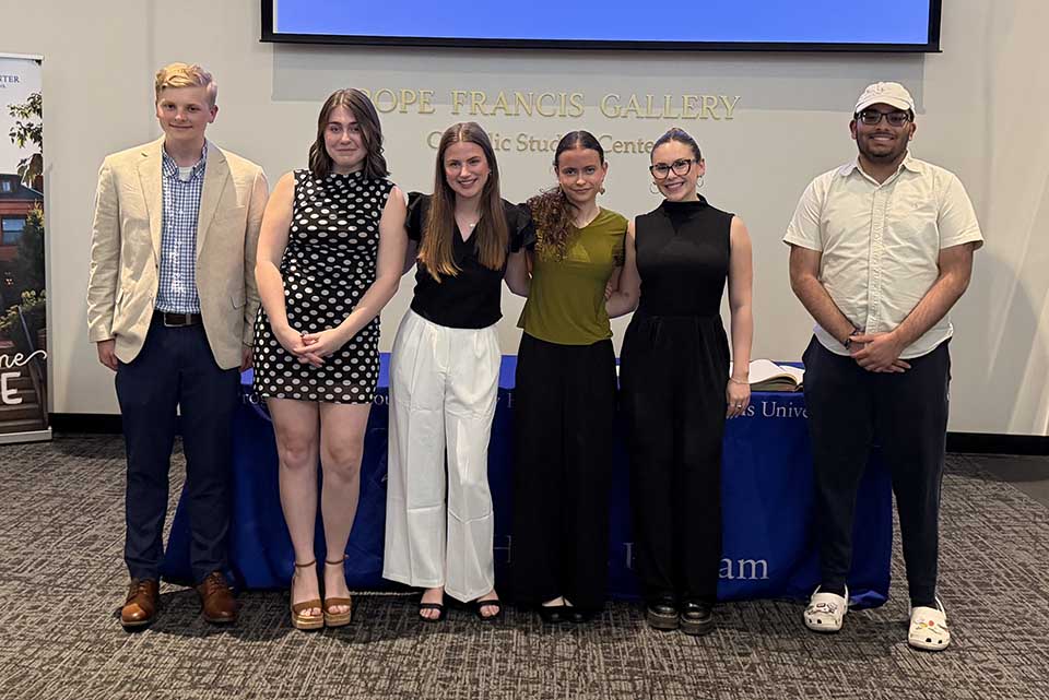 people stand in a line and pose for a photo