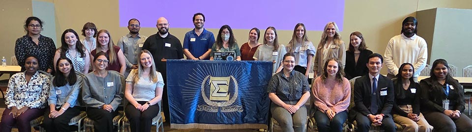 a group of people pose for a photo