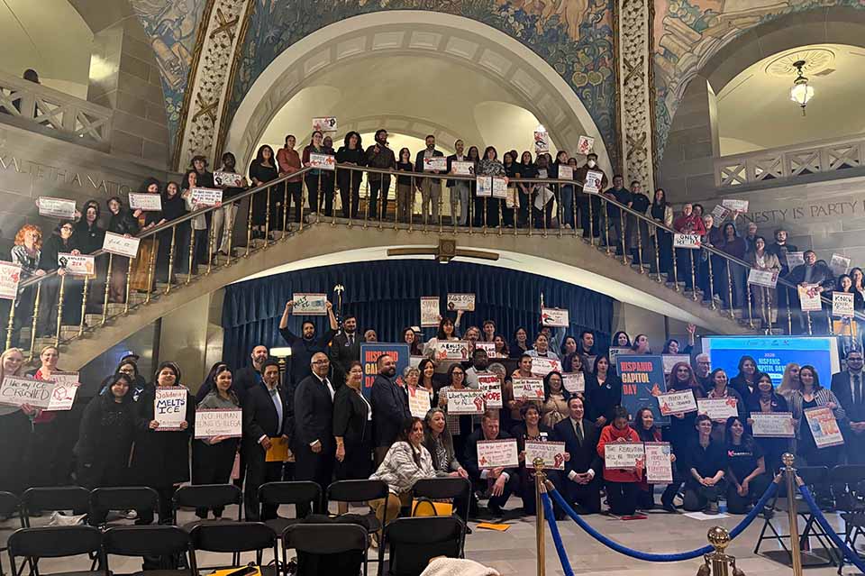 students pose for a picture in the state capitol