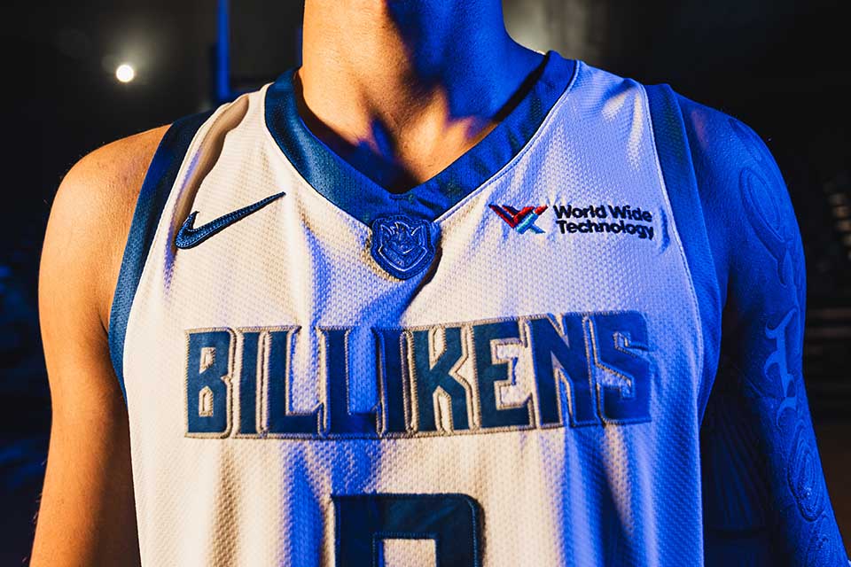 a close-up of a slu basketball jersey with a world wide technology patch
