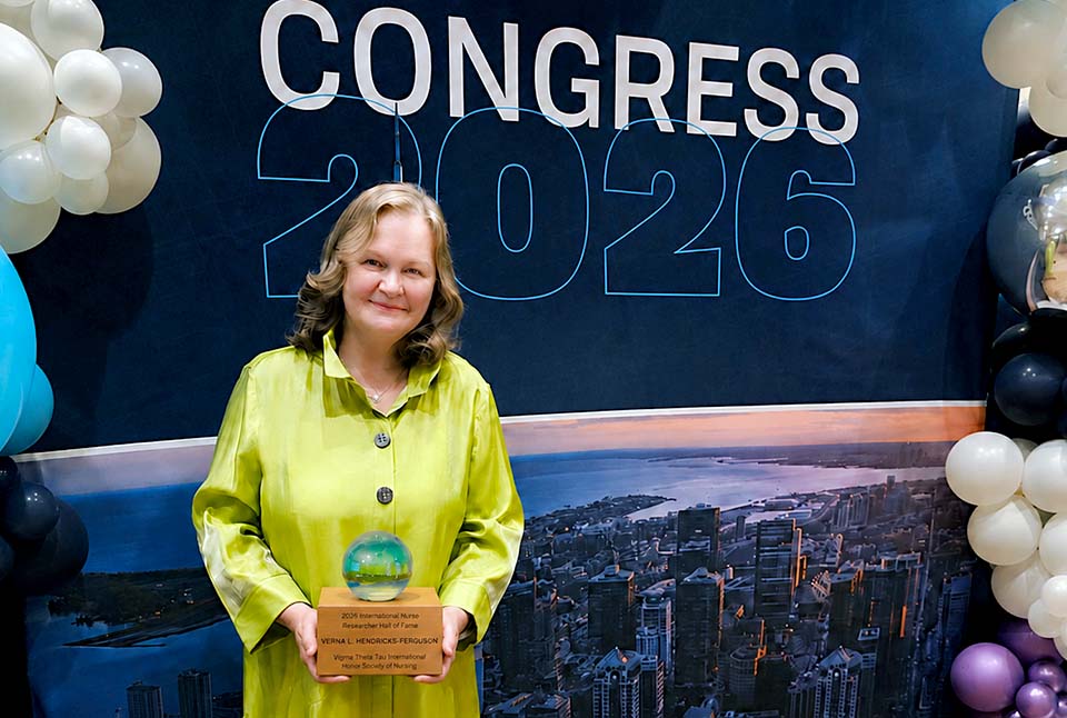 a woman holding a trophy