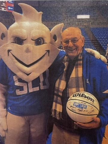 Fr. Apel with Billiken