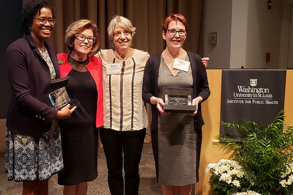 Marla Berg-Weger with award