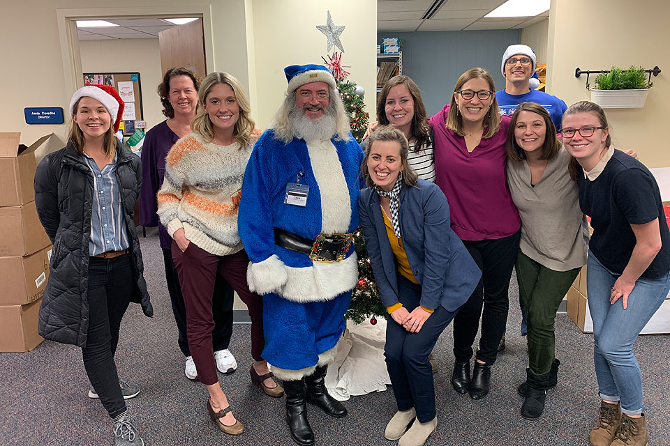 Blue Santa stops for a photo