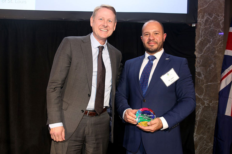 (Right) Tim Nowak, executive director, World Trade Center St. Louis, and Hadi Alhorr, Ph.D., director of the Boeing Institute of International Business in the Richard A. Chaifetz School of Business, stand with the award Alhorr accepted on the institute's behalf.