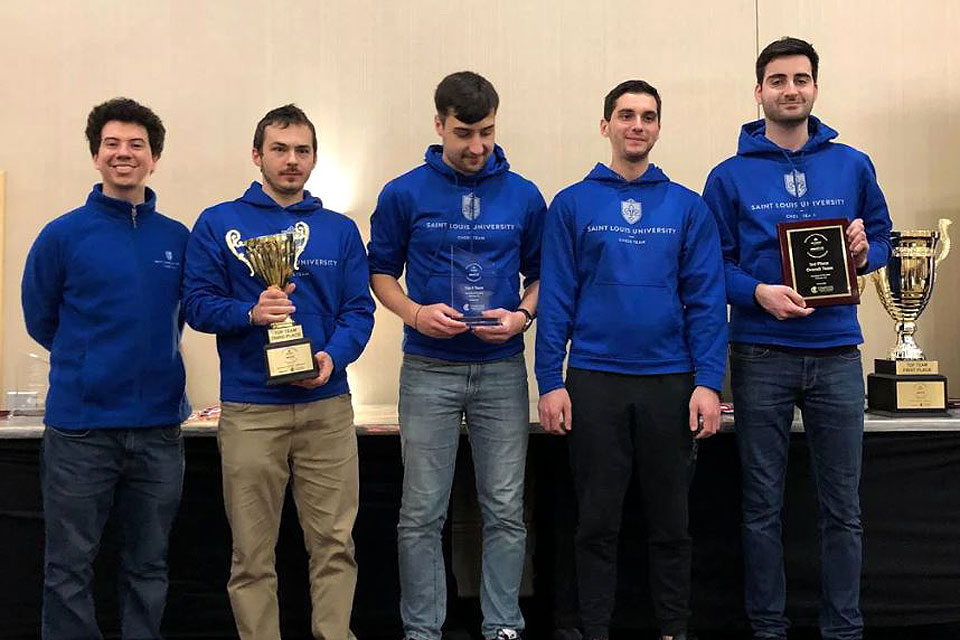 SLU's chess team poses with their trophy after placing third at the 2019 Pan-American Intercollegiate Chess Championships.