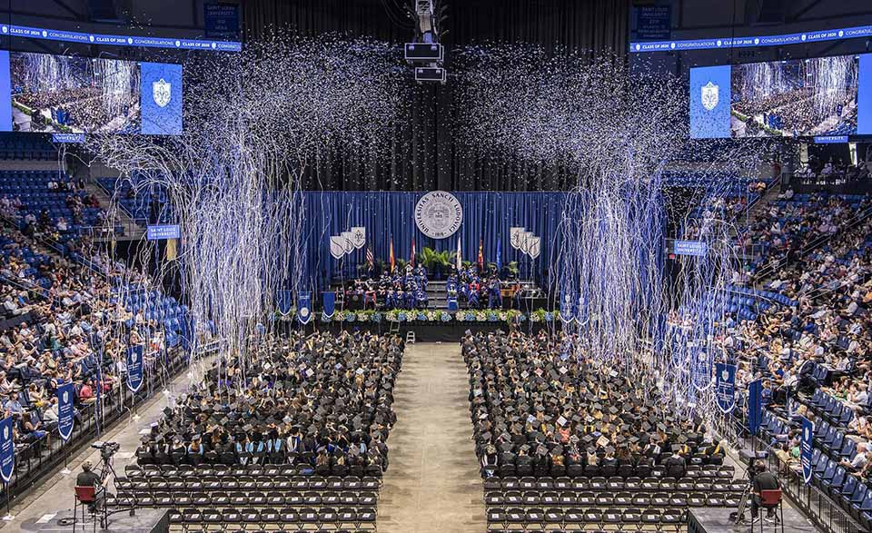 Confetti falls on Saint Louis University graudates. Photo by Steve Dolan.