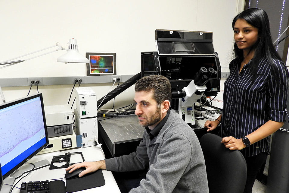 Flavio Esposito, Ph.D., with senior Samiksha Mailarpwar