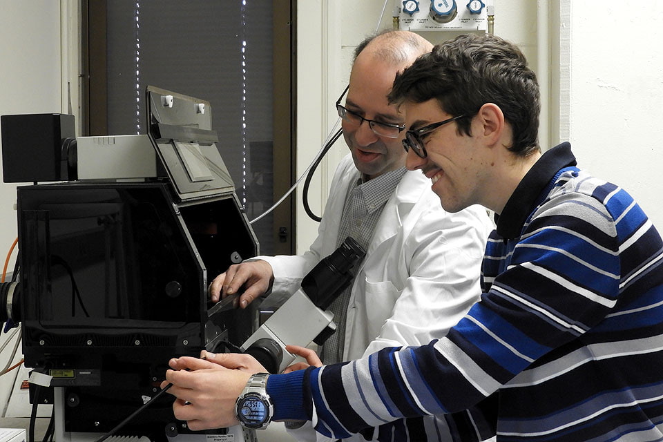 Grant Kolar, M.D., Ph.D., with visiting graduate student Alessio Sacco