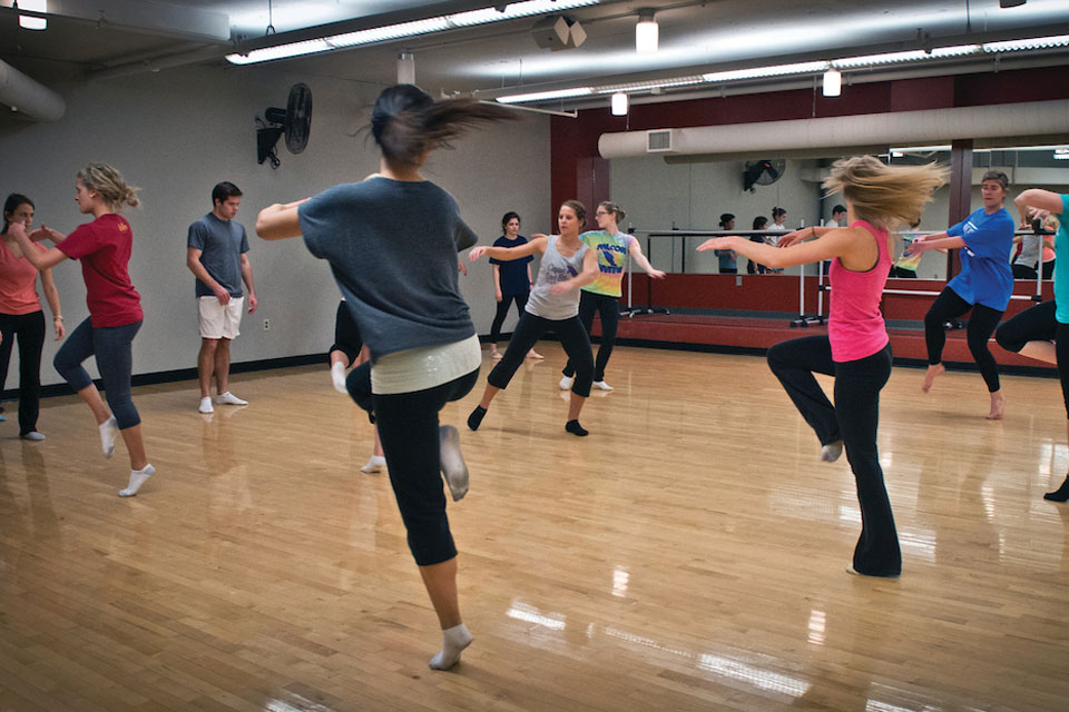 Students spin and whirl in a zumba class in the Simon Recreation Center.