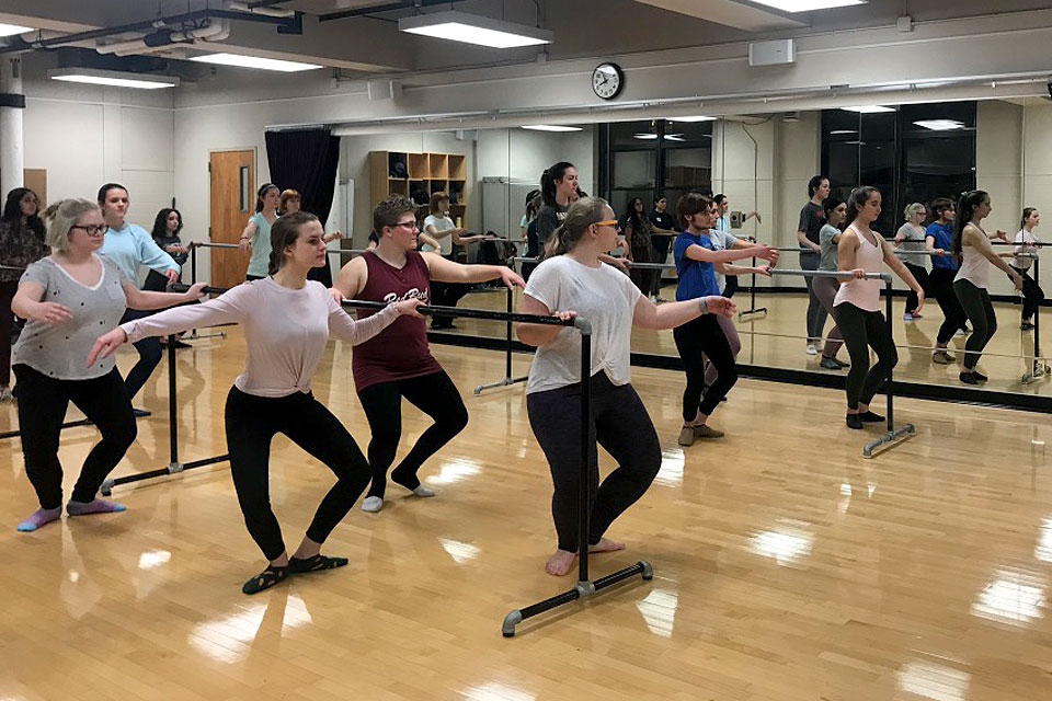 Students take part in a barre class in a studio in Xavier Hall as part of Make Dark Days Brighter.